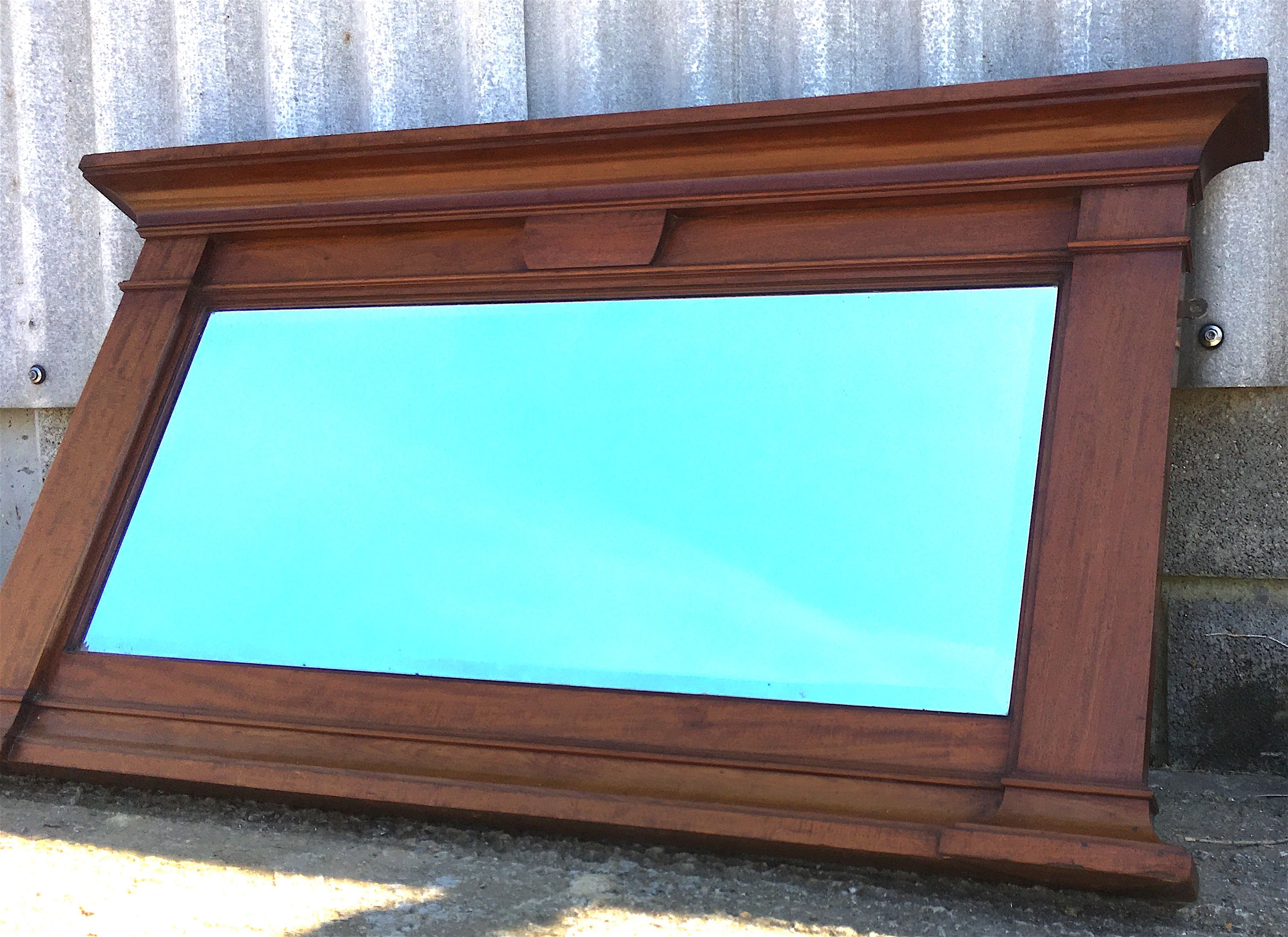 An early 20th century mahogany overmantel mirror, width 144cm, height 77cm